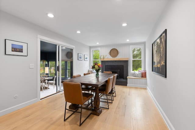 8019 Clouse Rd, New Albany, OH 43054 - dining area featuring light wood-type flooring, a fireplace, and recessed lighting