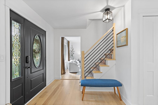 8019 Clouse Rd, New Albany, OH 43054 - entryway with wood finished floors and stairway