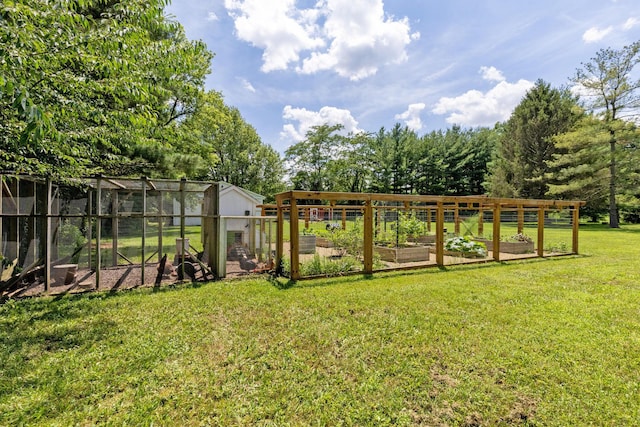 8019 Clouse Rd, New Albany, OH 43054 - view of green lawn with a vegetable garden, exterior structure, and an outbuilding