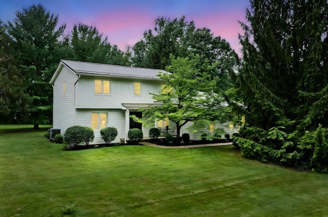 8019 Clouse Rd, New Albany, OH 43054 - view of front of property with a front lawn, board and batten siding, and a metal roof