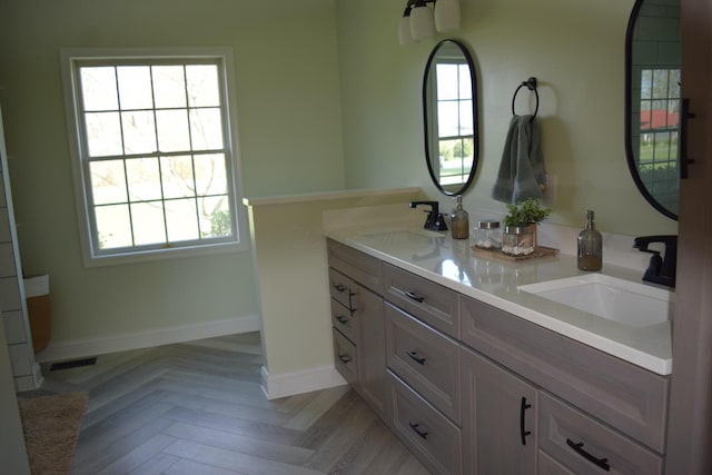 11283 Palmer Rd SW, Pataskala, OH 43062 - bathroom featuring a sink, baseboards, and double vanity