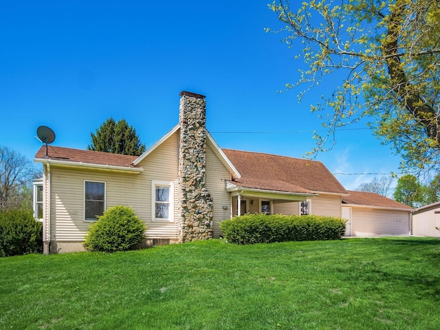 88 Tallman St, North Lewisburg, OH 43060 - view of front of property with a chimney and a front lawn