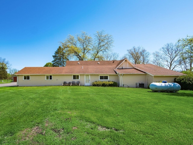 88 Tallman St, North Lewisburg, OH 43060 - rear view of property with central air condition unit and a yard