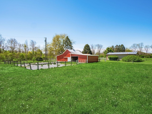 88 Tallman St, North Lewisburg, OH 43060 - view of yard with fence, a pole building, an outdoor structure, and an exterior structure