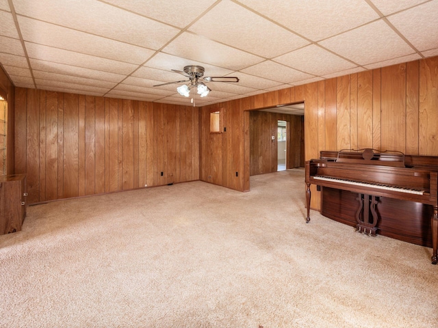88 Tallman St, North Lewisburg, OH 43060 - interior space featuring wooden walls, ceiling fan, light colored carpet, and a paneled ceiling