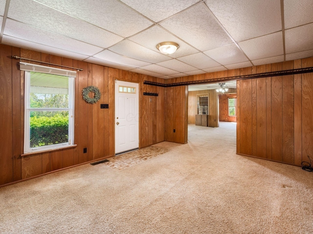 88 Tallman St, North Lewisburg, OH 43060 - spare room featuring plenty of natural light, carpet flooring, and wood walls