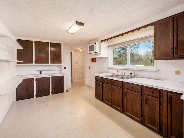 88 Tallman St, North Lewisburg, OH 43060 - kitchen featuring a sink, light countertops, open shelves, and dark brown cabinetry