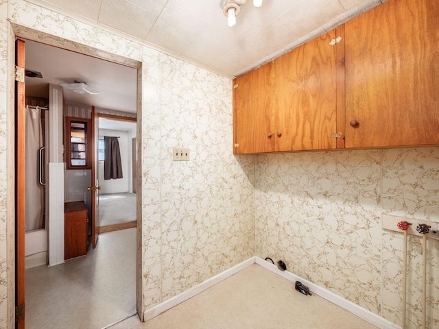 88 Tallman St, North Lewisburg, OH 43060 - laundry room featuring crown molding and baseboards