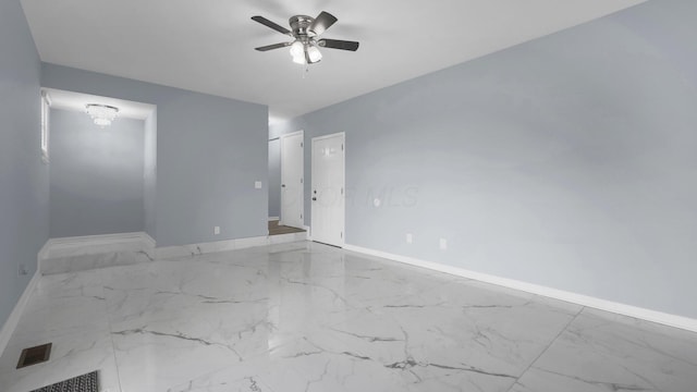 unfurnished room featuring visible vents, marble finish floor, baseboards, and ceiling fan