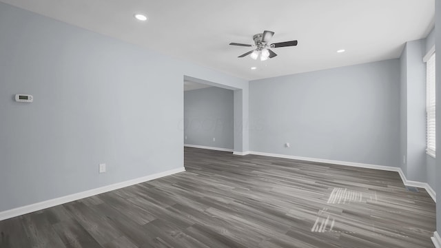 empty room with baseboards, a ceiling fan, wood finished floors, and recessed lighting