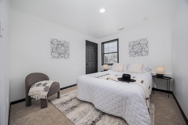 carpeted bedroom featuring recessed lighting, visible vents, and baseboards