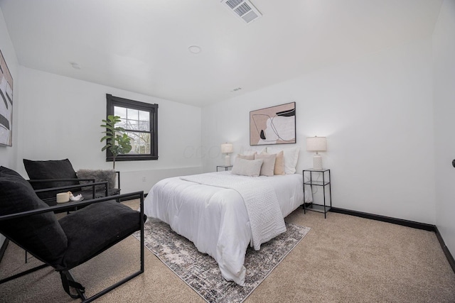 bedroom with carpet flooring, visible vents, and baseboards
