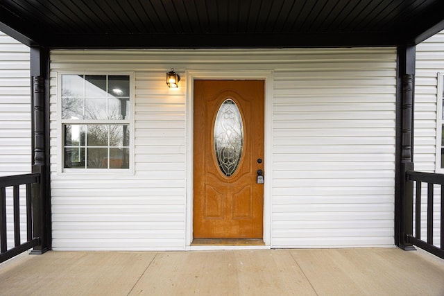 property entrance featuring a porch