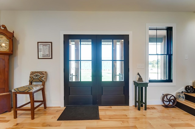 9730 Lancaster Kirkersville Rd NW, Baltimore, OH 43105 - entryway with french doors, baseboards, and light wood finished floors