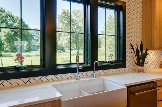 9730 Lancaster Kirkersville Rd NW, Baltimore, OH 43105 - room details featuring dishwasher, a sink, backsplash, and light stone countertops