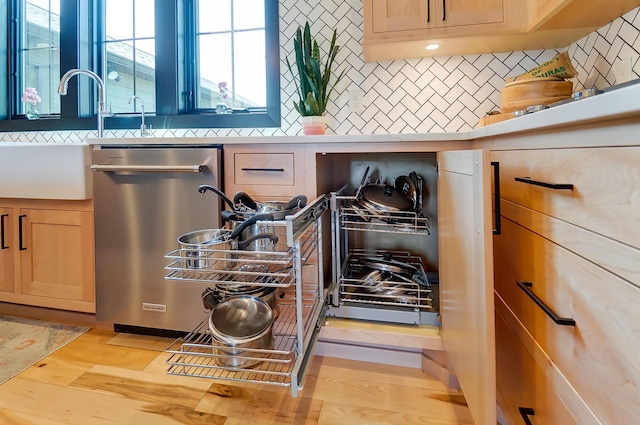 9730 Lancaster Kirkersville Rd NW, Baltimore, OH 43105 - interior details with stainless steel dishwasher, tasteful backsplash, light countertops, and a sink