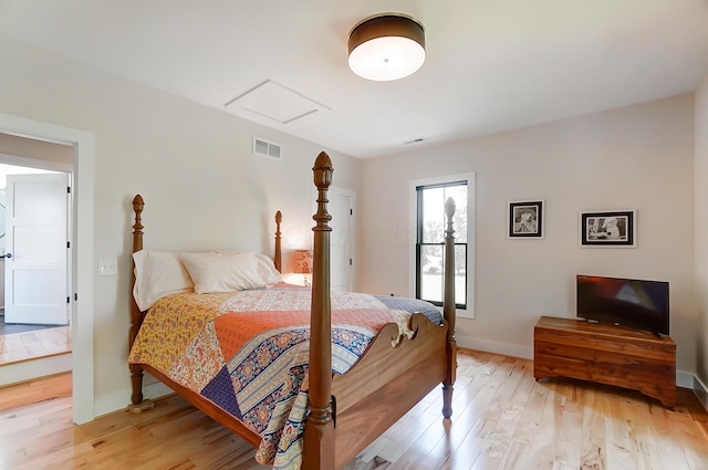 9730 Lancaster Kirkersville Rd NW, Baltimore, OH 43105 - bedroom featuring light wood-style floors, visible vents, baseboards, and attic access