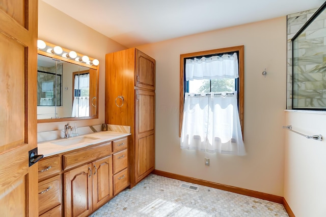 9730 Lancaster Kirkersville Rd NW, Baltimore, OH 43105 - bathroom featuring baseboards, visible vents, an enclosed shower, and vanity