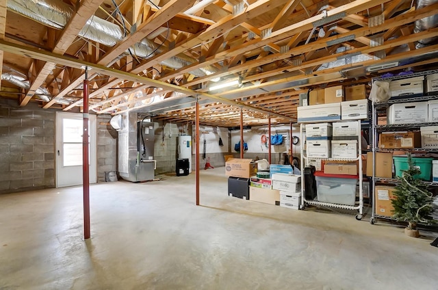 9730 Lancaster Kirkersville Rd NW, Baltimore, OH 43105 - basement featuring concrete block wall, heating unit, and electric water heater