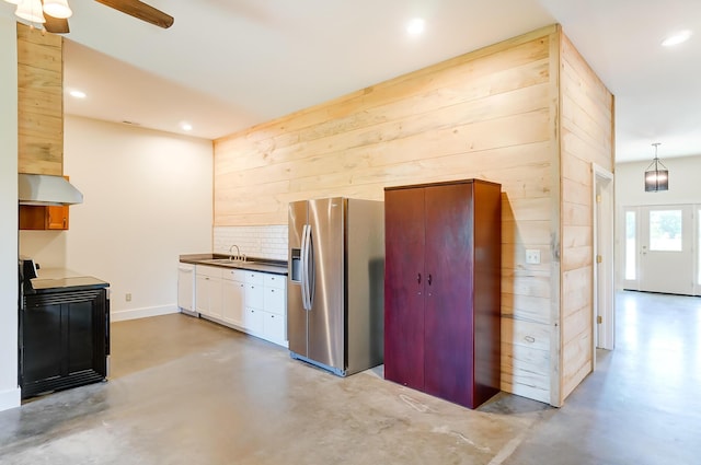 9730 Lancaster Kirkersville Rd NW, Baltimore, OH 43105 - kitchen featuring a sink, finished concrete floors, stove, stainless steel fridge with ice dispenser, and under cabinet range hood