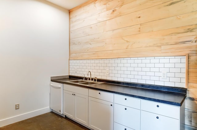 9730 Lancaster Kirkersville Rd NW, Baltimore, OH 43105 - kitchen featuring dark countertops, tasteful backsplash, a sink, white cabinets, and baseboards