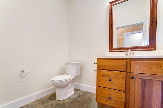 9730 Lancaster Kirkersville Rd NW, Baltimore, OH 43105 - bathroom with unfinished concrete flooring, baseboards, vanity, and toilet