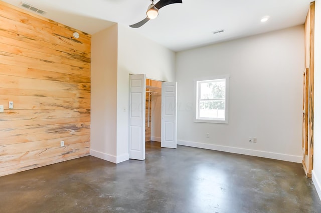 9730 Lancaster Kirkersville Rd NW, Baltimore, OH 43105 - unfurnished bedroom featuring concrete floors, visible vents, baseboards, and ceiling fan