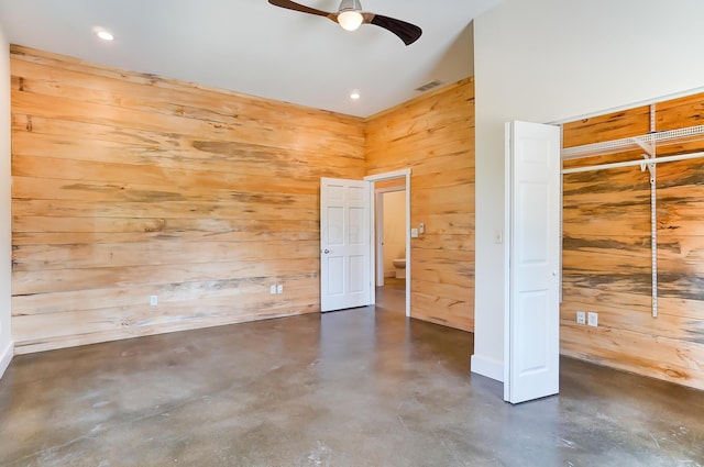 9730 Lancaster Kirkersville Rd NW, Baltimore, OH 43105 - unfurnished bedroom featuring recessed lighting, wood walls, visible vents, a closet, and finished concrete floors
