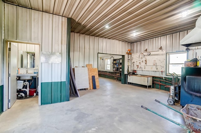 9730 Lancaster Kirkersville Rd NW, Baltimore, OH 43105 - misc room with concrete flooring, a sink, and a workshop area