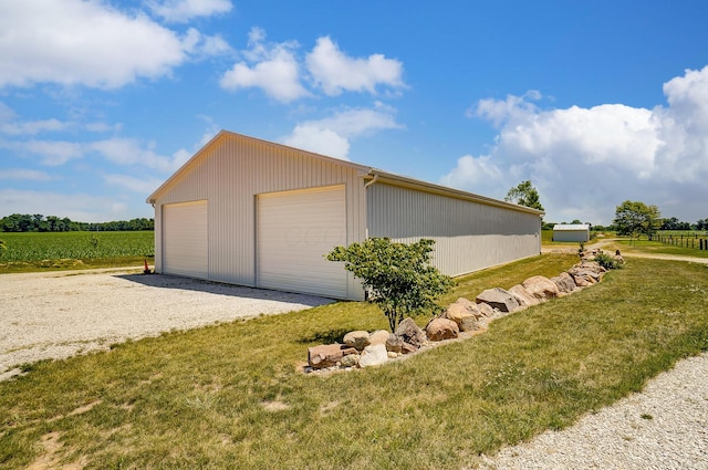 9730 Lancaster Kirkersville Rd NW, Baltimore, OH 43105 - view of side of property featuring a rural view, an outbuilding, a garage, and a lawn