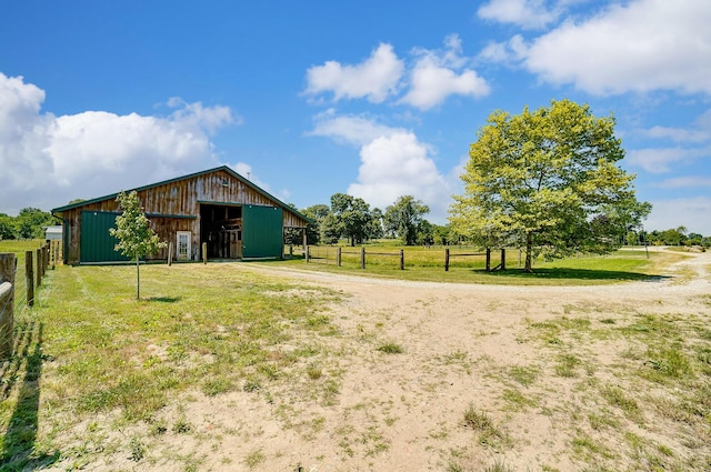 9730 Lancaster Kirkersville Rd NW, Baltimore, OH 43105 - view of yard with fence, driveway, an outbuilding, and a garage