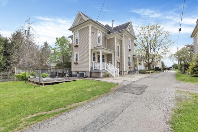 328 Pearl St, Jackson, OH 45640 - view of side of property featuring central AC, fence, and a lawn