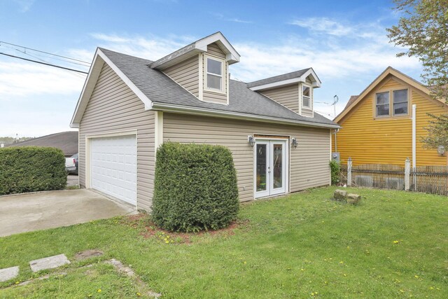 328 Pearl St, Jackson, OH 45640 - view of home's exterior featuring french doors, fence, a garage, a shingled roof, and a yard