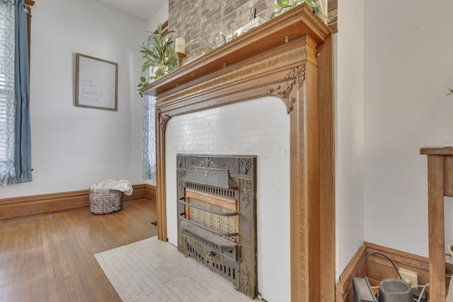328 Pearl St, Jackson, OH 45640 - room details featuring a fireplace, wood finished floors, and baseboards