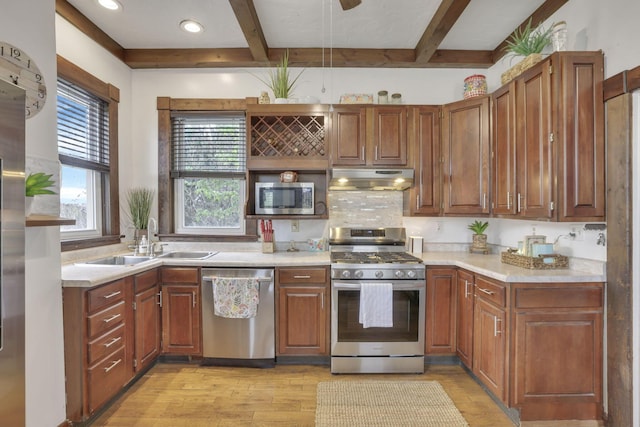 328 Pearl St, Jackson, OH 45640 - kitchen with light wood finished floors, beam ceiling, a sink, under cabinet range hood, and appliances with stainless steel finishes