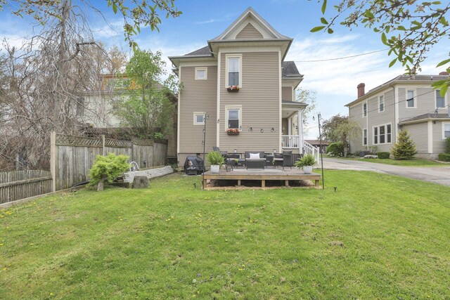 328 Pearl St, Jackson, OH 45640 - rear view of house with fence, a wooden deck, a yard, and an outdoor living space