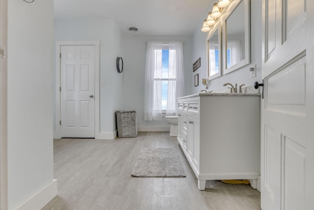 328 Pearl St, Jackson, OH 45640 - bathroom with toilet, visible vents, baseboards, wood finished floors, and vanity