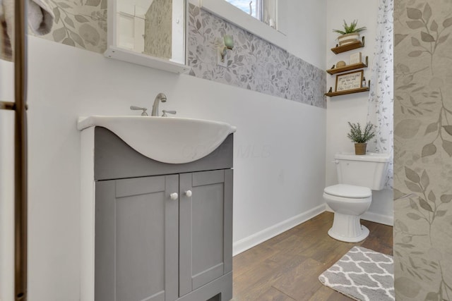 328 Pearl St, Jackson, OH 45640 - bathroom featuring toilet, vanity, wood finished floors, and baseboards