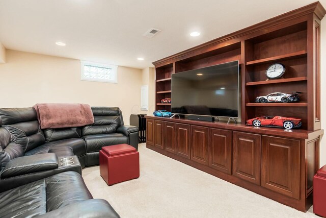 living room with light carpet, visible vents, and recessed lighting