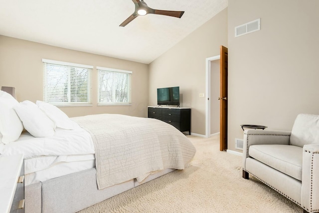 bedroom featuring vaulted ceiling, visible vents, light carpet, baseboards, and ceiling fan