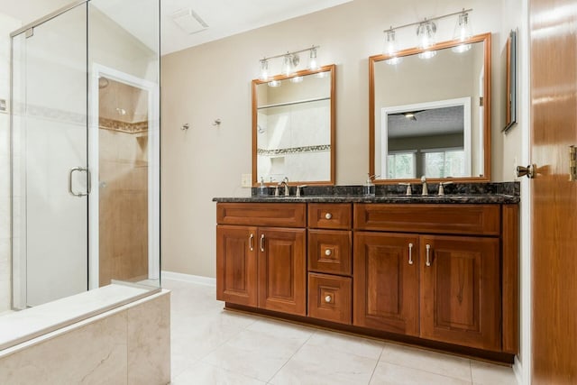 full bath with a shower stall, a sink, and visible vents