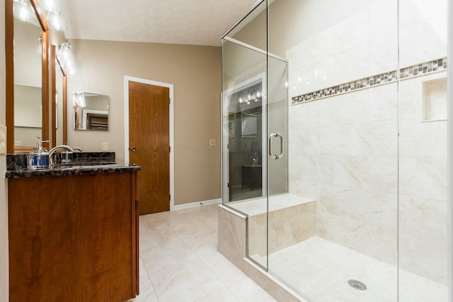 full bathroom with a shower stall, tile patterned flooring, and vanity