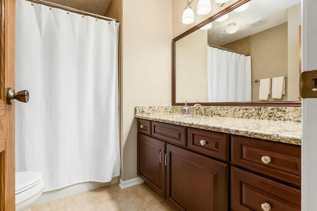 bathroom with toilet, a shower with curtain, vanity, and tile patterned floors