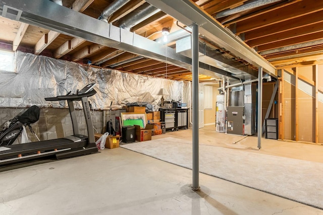 unfinished below grade area with heating unit and gas water heater