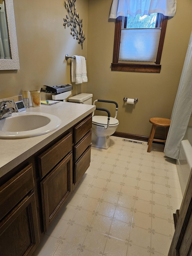 7918 Sethwick Rd, Dublin, OH 43016 - full bathroom with tile patterned floors, toilet, vanity, and baseboards