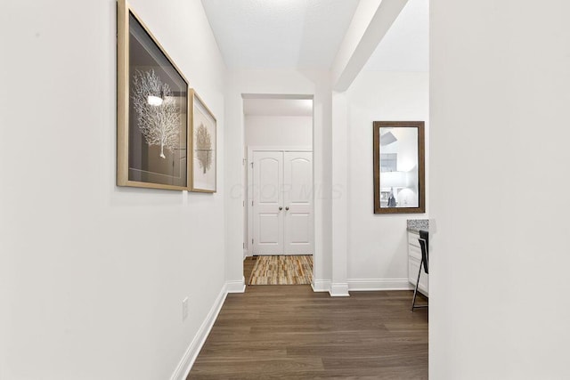 2418 Home Rd, Powell, OH 43065 - corridor with baseboards and dark wood-type flooring
