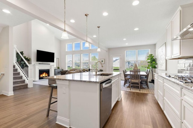 2418 Home Rd, Powell, OH 43065 - kitchen with dark wood finished floors, stainless steel appliances, a sink, and recessed lighting