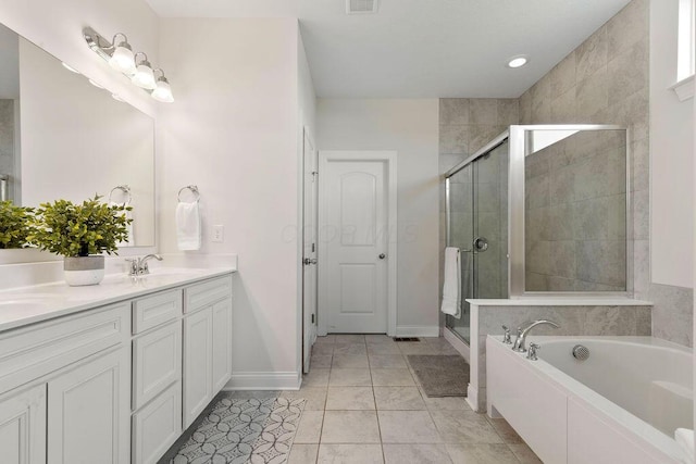 2418 Home Rd, Powell, OH 43065 - full bath featuring a garden tub, baseboards, double vanity, and a stall shower