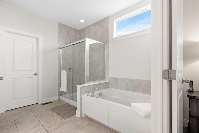 2418 Home Rd, Powell, OH 43065 - full bath featuring a garden tub, tile patterned flooring, and a stall shower