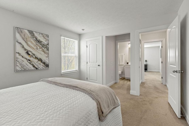 2418 Home Rd, Powell, OH 43065 - bedroom featuring baseboards, a textured ceiling, and light colored carpet